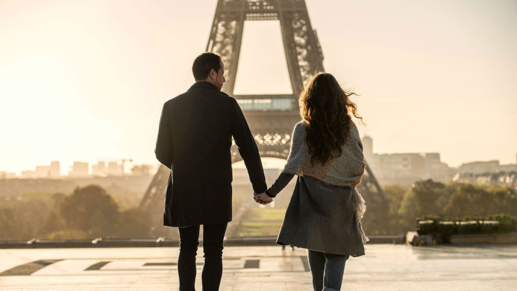 french couple holding hands